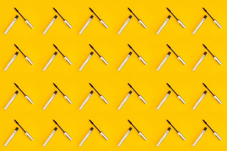 A collage of yellow color with mascaraの写真素材