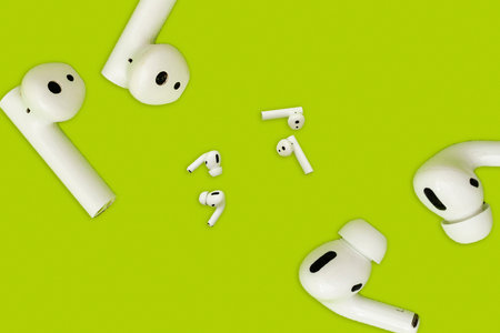 Collage green color with white wireless headphones