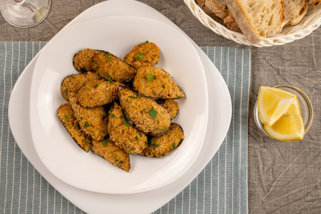 Gratin mussels. Italian finger food. Seafood appetizer of typical Italian cuisine. Sea snacks. Flat lay.の写真素材