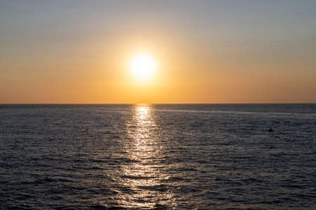 Sunset on the mediterranean sea in summer near the port of Procida, gulf of Naples, Italyのeditorial素材