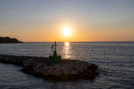 Sunset on the mediterranean sea in summer near the port of Procida, gulf of Naples, Italyのeditorial素材