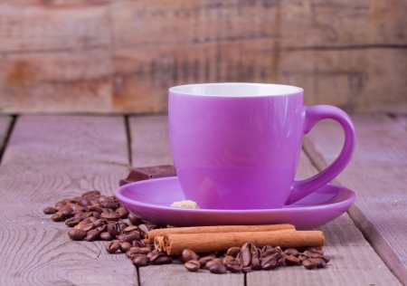 Cup of coffee with coffee beans and cinnamonの写真素材