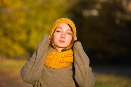 portrait of young woman in autumn parkの写真素材