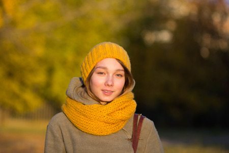 portrait of young woman in autumn parkの写真素材
