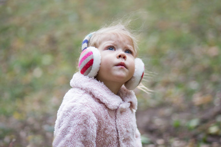 beautiful little girl looking upの写真素材