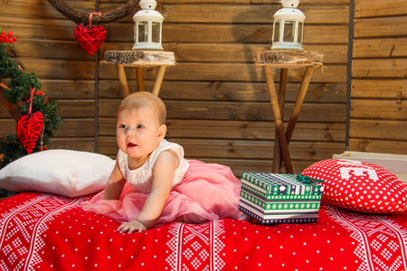 sweet baby on the red blanketの写真素材