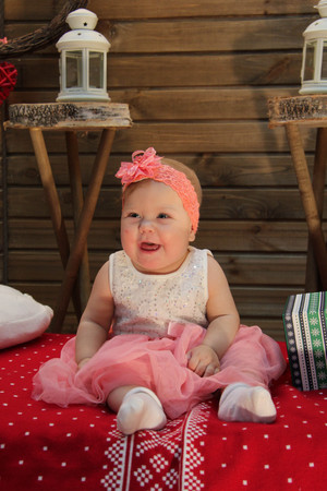 sweet baby on the red blanketの写真素材