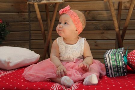 sweet baby on the red blanketの写真素材