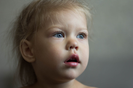 portrait of a little girl looking asideの写真素材