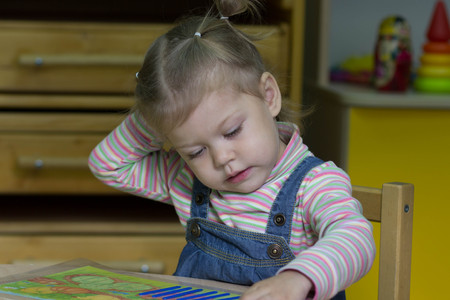 little girl playing with counting sticks on the arithmeticの写真素材
