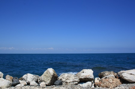 view of big stones on the seashore with blue seaの写真素材