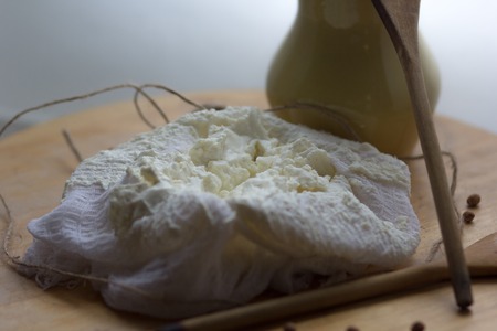 fresh homemade farm creamy cottage cheese tvorog in cheeseclothの写真素材