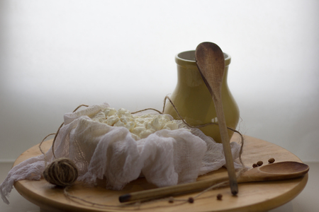 fresh homemade farm creamy cottage cheese tvorog in cheeseclothの写真素材