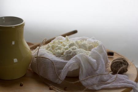fresh homemade farm creamy cottage cheese tvorog in cheeseclothの写真素材