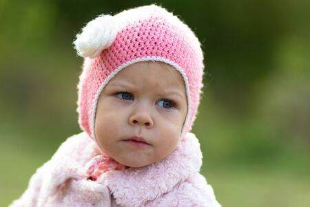 Little girl in the autumn parkの写真素材