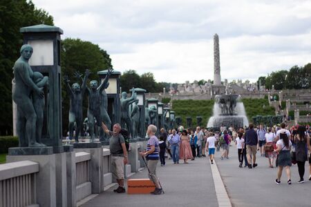 Oslo Norway - 22 june 2019: Vigeland Park, Bridge with view of the Fountain and the Monolith with...
