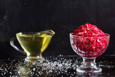 Raw beetroot, carrot and cabbage salad on the black backgroundの写真素材