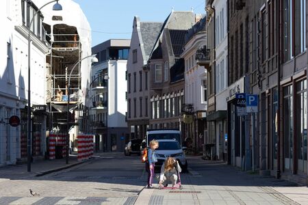 Fredrikstad Norway - 17 june 2019 : woman with a child and scooter on crosswalkのeditorial素材