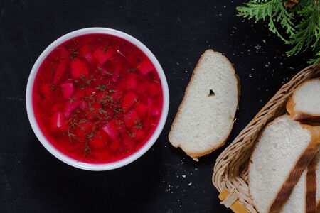 Top view of beetroot soup in white bowl on the black backgroundの写真素材