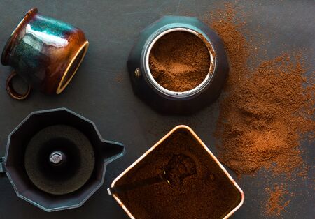 Ground coffee and geyser coffee maker on the black backgroundの写真素材