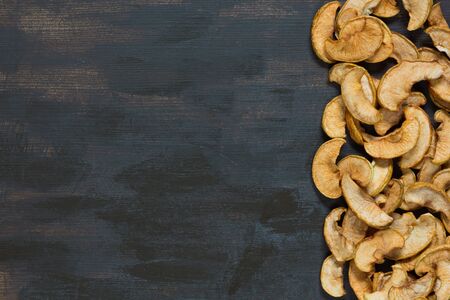 Flat lay with dried apple on the brown backgroundの写真素材