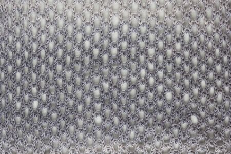 background made from honeycomb mesh lace knitting pattern made from the gray gradient yarn