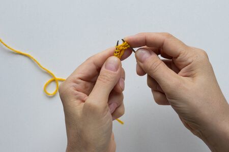 Knitting. Three stitches on right needle on the white background. Top viewの写真素材