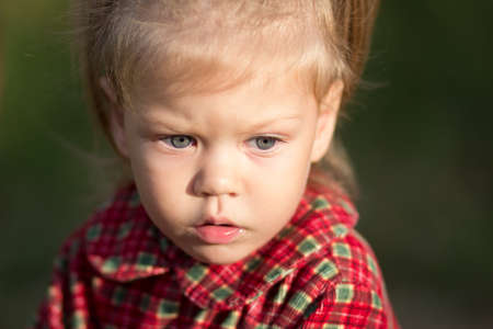 Portrait of caucasian child of two years with serious look