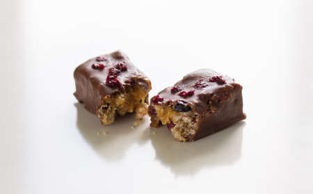 Close up cut chocolate with filling on white background
