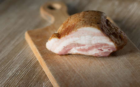 Piece of brisket on the wooden cutting boardの写真素材