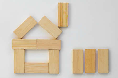 Top view of method how to play with wooden dominoes gaming pieces for children on white backgroundの写真素材