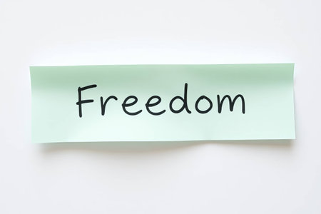 Text Freedom on blue note on white backgroundの素材