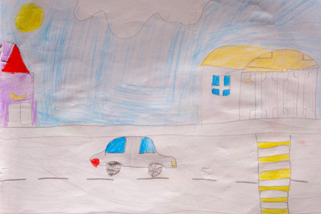 Car moving on city road painted by child using pencils on white paper in naive styleの写真素材