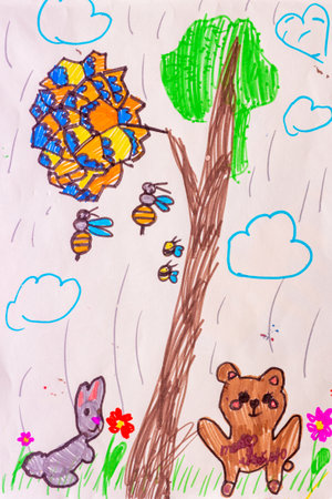 A colorful children's drawing of a bear, a bunny, and bees around a tree with a beehive. The playful, hand-drawn style creates a cheerful and whimsical nature scene full of joy and creativity.の写真素材