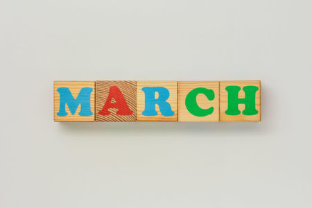 March message built with wooden letter cubes on white backgroundの写真素材