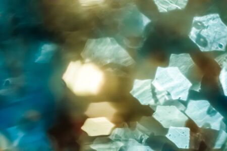 Abstract closeup background with blurred shining bokeh lightsの写真素材