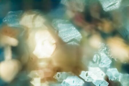 Abstract closeup background with blurred shining bokeh lightsの写真素材