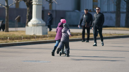 Moscow, Russia - August 25, 2019: Street photography. Children on the city street in the spring...