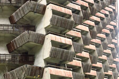 Balconies. Geometry. Wooden balconies of unfinished building. Balconies look like gondols. Balcones...