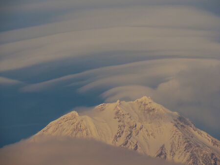 Landscape with the Arenal volcano which hangs over the lenticular cloudの写真素材