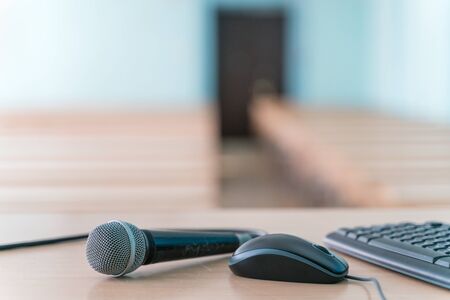 microphone on a table in an empty classroom for lecturesの写真素材
