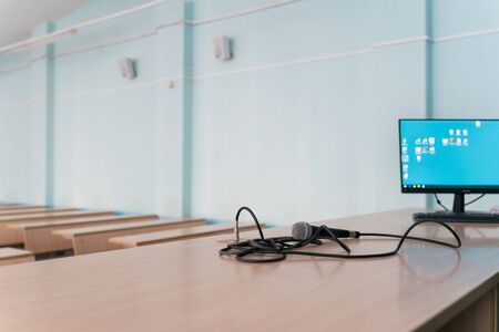microphone on a table in an empty classroom for lectures