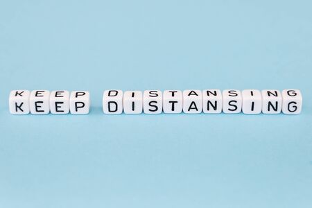 word composed with cubes on a blue background with space for textの写真素材