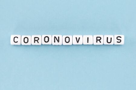 word composed with cubes on a blue background with space for textの写真素材