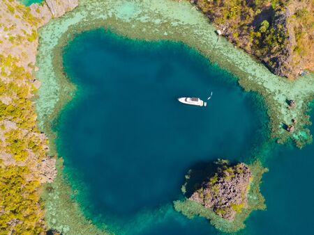 Twin Lagoon in Coron, Palawan, Philippines. Mountain and Sea. Lonely Boat