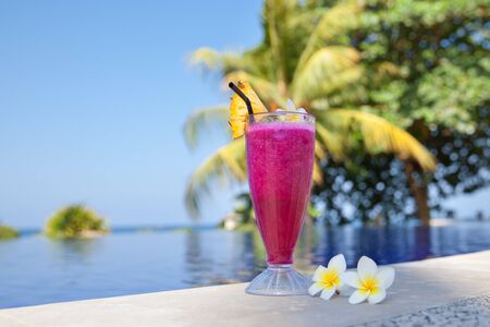 Dragon fruit juice. Hotel rest. Dragon fruit shake. Fresh cocktail and frangipani flowers by the...