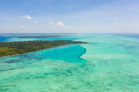 Coral reefs and atolls in the tropical sea, top view. Turquoise sea water and beautiful shallows. Philippine nature.の写真素材