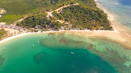 Las Cabanas Beach. Islands and beaches of El Nido.Tropical islands with white sandy beaches, aerial...