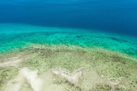 Transparent sea water, top view. Aerial view of calm sea water. Top view of a clean ocean water near...