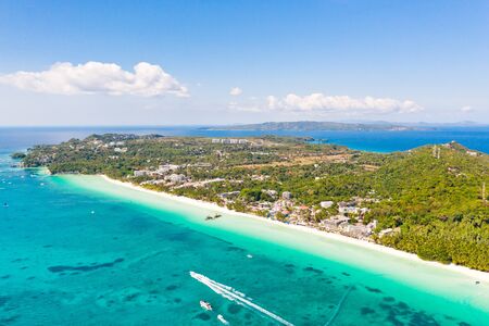 White beach on the island of Boracay, Philippines, top view. White sandy beach and turquoise sea water in sunny weather. Residential development and many hotels in Boracay.の写真素材